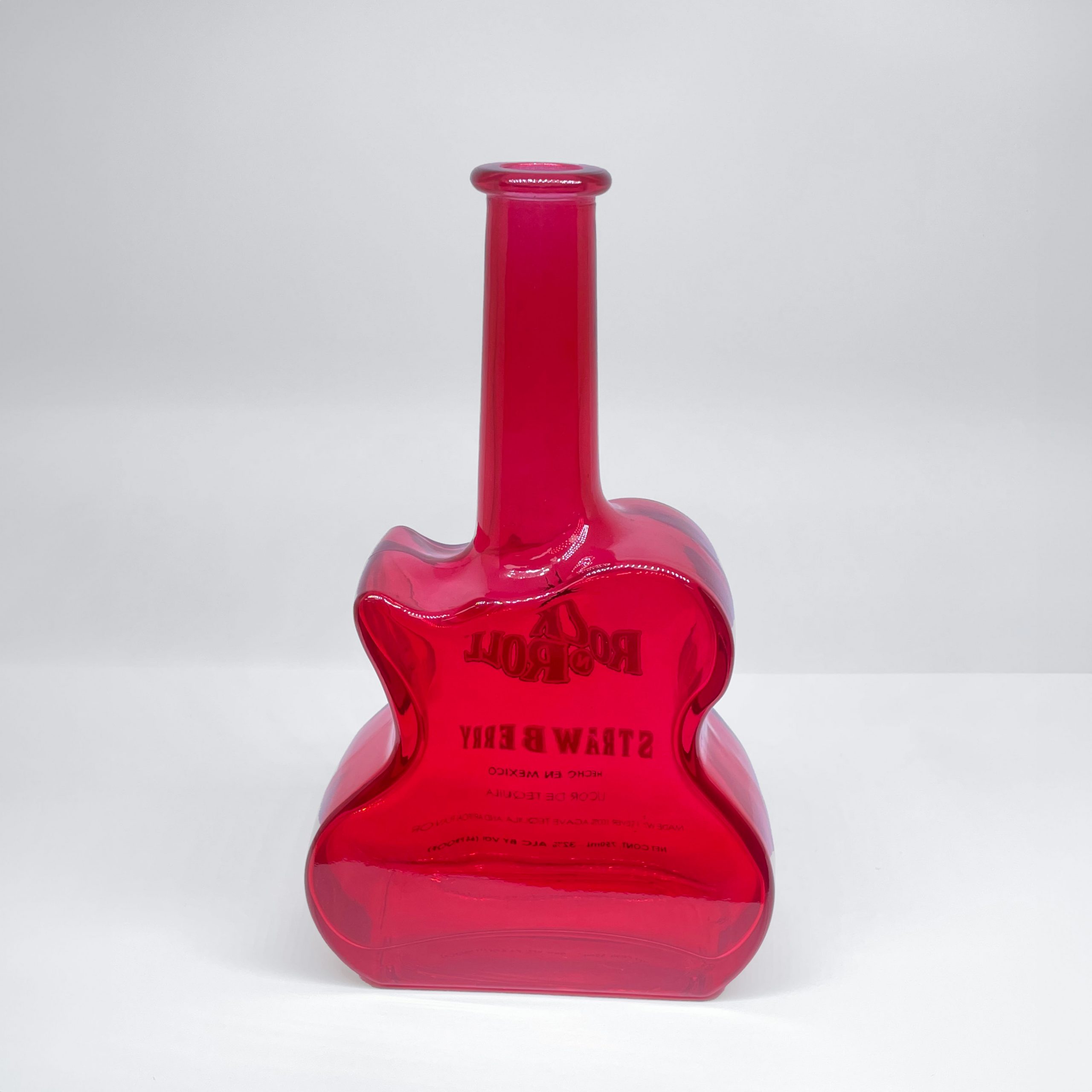 A special custom-shape drinks bottle in coloured glass. We can create any shape and any colour!
