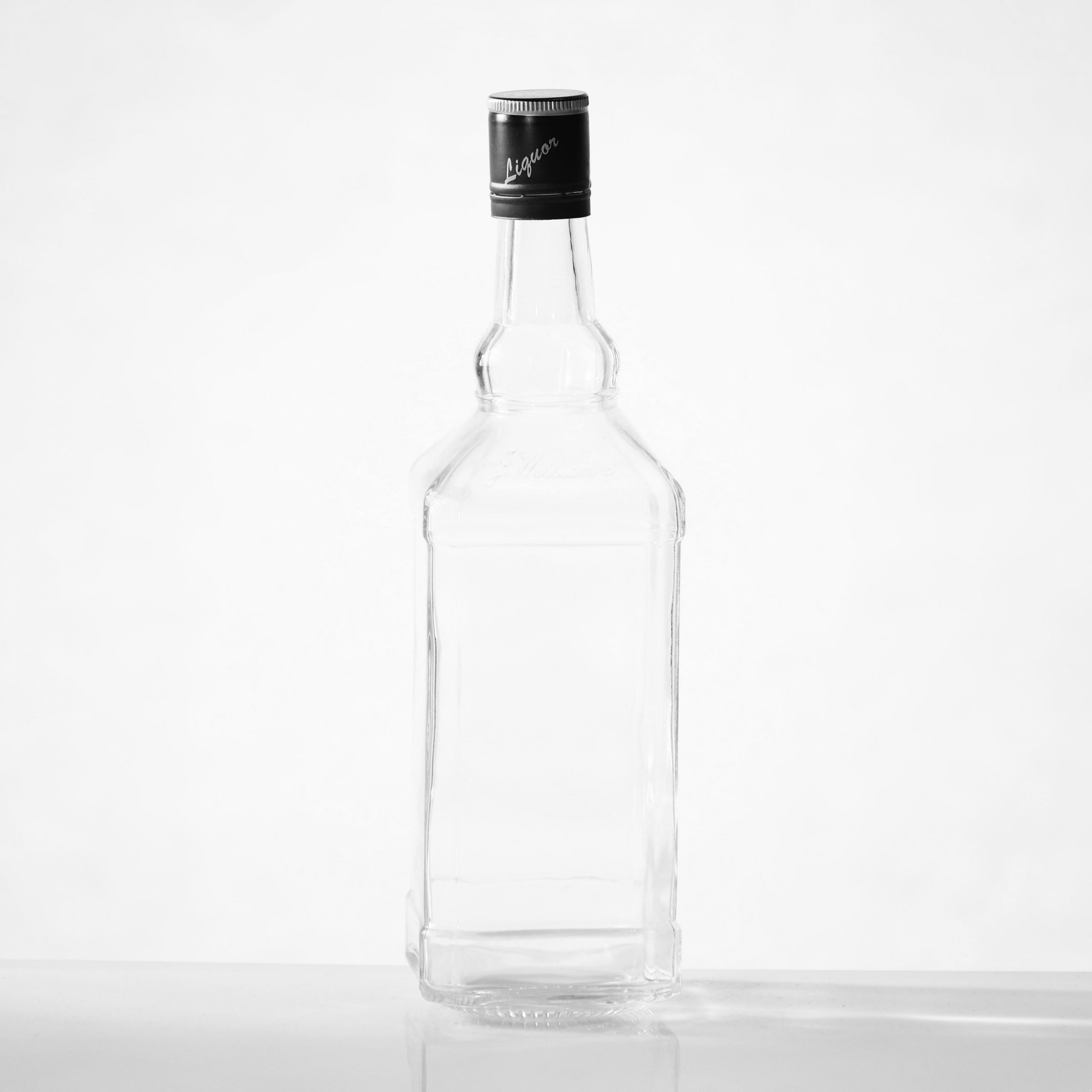 Clear glass, classic whiskey bottle ideal for spirits, whisky or any liquor of your choice. We can add your logo, brand or label.